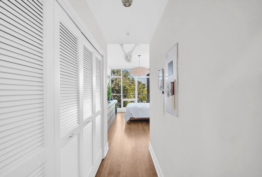 Primary Bedroom Hallway with Ample Closet Space - 175 1st St S