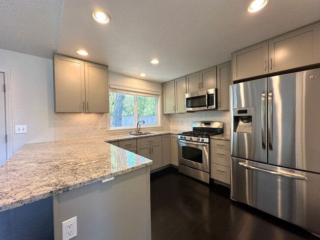 Building Photo - Rambler Retreat – Style, Space, and Steila...