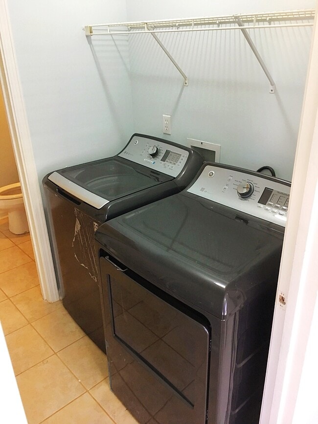 A laundry room is directly inside the front door. Brand new washer and dryer. - 190 Hutchinson St NE