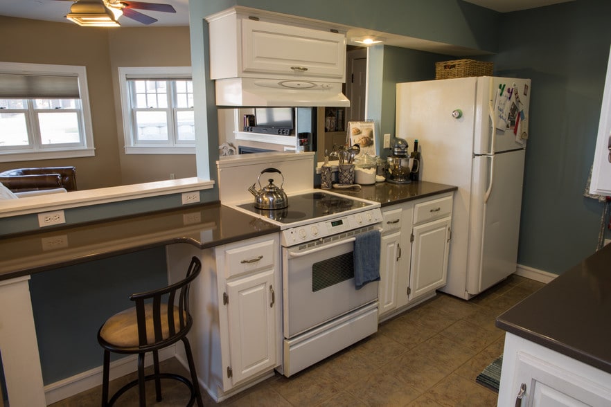 Kitchen open to living area. Eat-in counter. - 2010 E Iron St