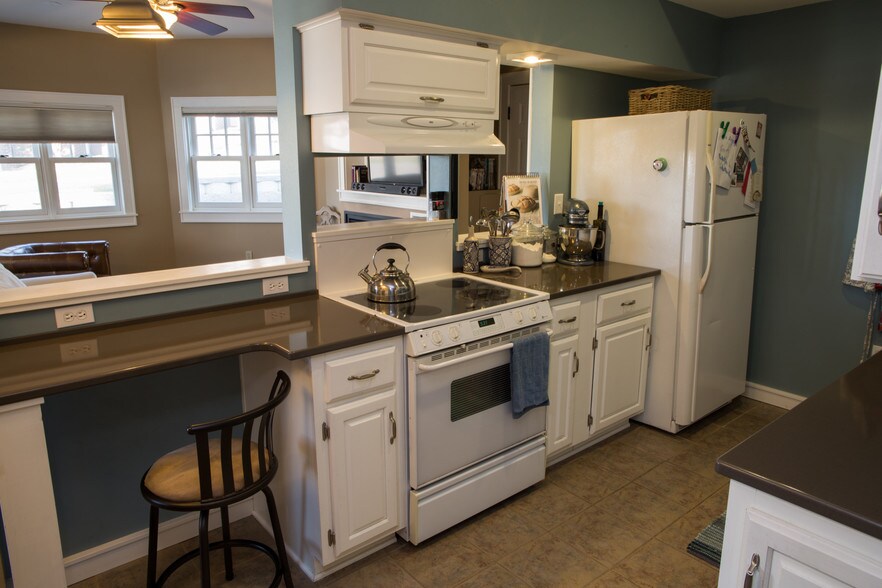 Kitchen to living area. Quartz counters. - 2010 E Iron St