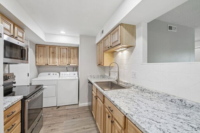 Building Photo - Townhome-Style Living with Greenbelt Views, Attached Garage & Community Pool!