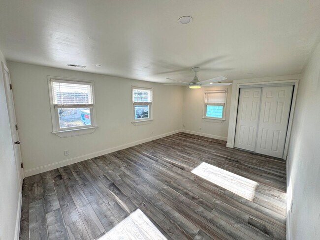 Building Photo - RENOVATED 3 bedroom end unit across the street from the Beach!
