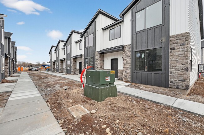 Building Photo - BRAND NEW 3 BED 2.5 BATH TOWNHOMES WITH 2 CAR GARAGE