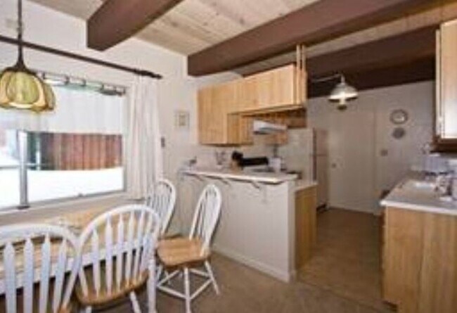 Building Photo - Unique open design,wood beams in all rooms-Very cheery and cozy. Newly remodeled, and newly furni...