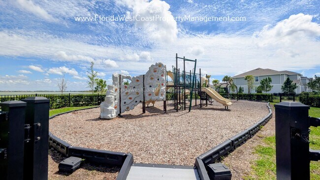 Building Photo - EXCEPTIONAL AND SPACIOUS FURNISHED TOWNHOME WITHIN WATERSIDE- NAUTIQUE!