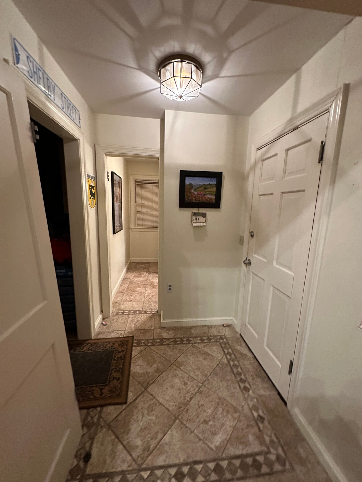 Tile Entry looking to down 1//2 Bth Down Stairs - 1203 E 25th St