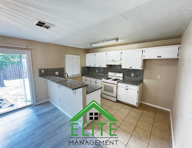 Building Photo - **Spacious 3-Bedroom Condo with 2-Car Gara...