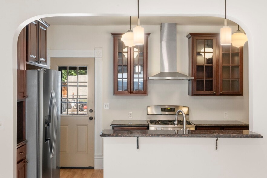 2 Private parking spaces in back with direct access door to kitchen. - 3347 Tejon St