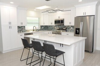 Building Photo - ANNUAL RENTAL Naples Park 3 Bedroom // 2 Bathroom Single Family Home