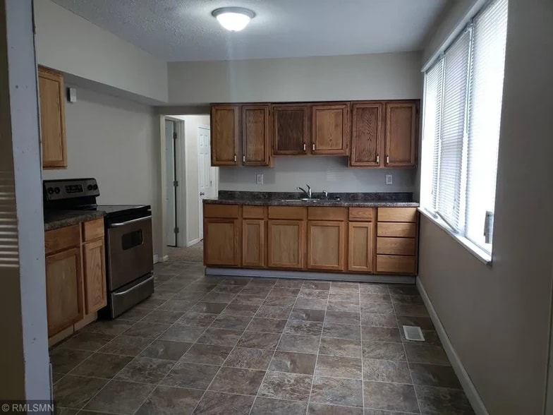 Kitchen looking towards two bedrooms and one bathroom - 678 Jessamine Ave E