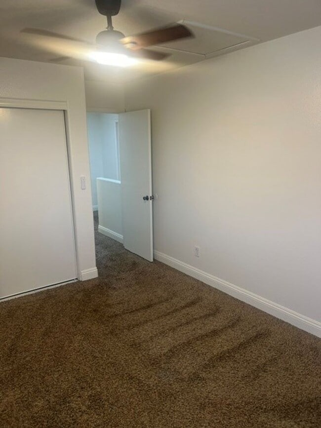 Building Photo - This three bedroom has the primary bedroom on the downstairs level.