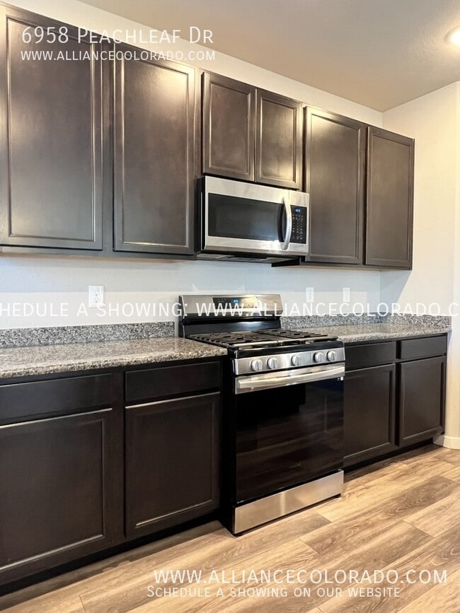 Building Photo - 6958 Peachleaf Dr