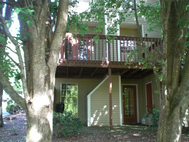 Upper deck and lower covered patio with outdoor storage. - 401 Wedgewood Way