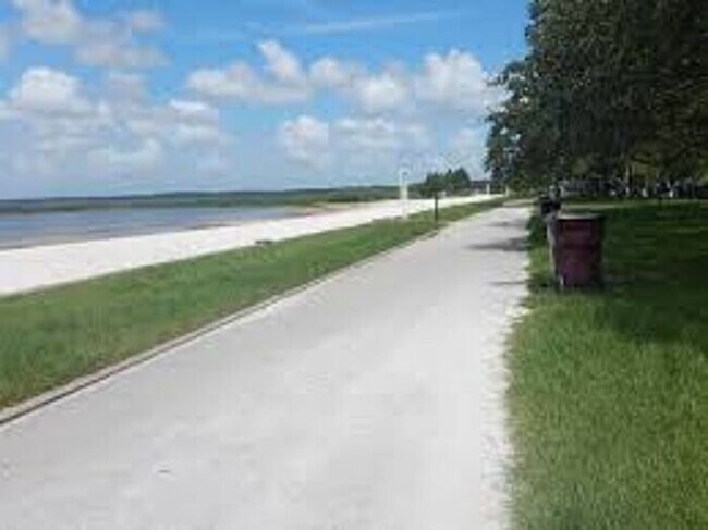 Building Photo - Like-New 4 Bedroom 3 Bath with Pond View & Two Living Spaces — Minutes to South Lake Nona