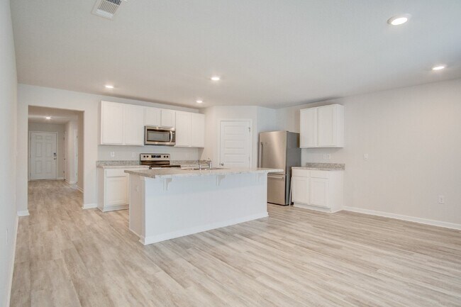 Building Photo - 4-Bed, 2-Bath Home in Woodlands Subdivision with Solar, Open-Concept Living, Modern Kitchen, Fenc...