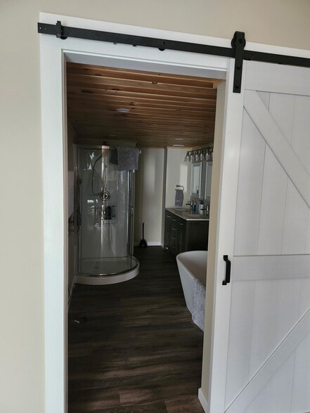 Barn Door entry to Primary Bath inside the Primary Bedroom - 8152 Wilson Karr Rd