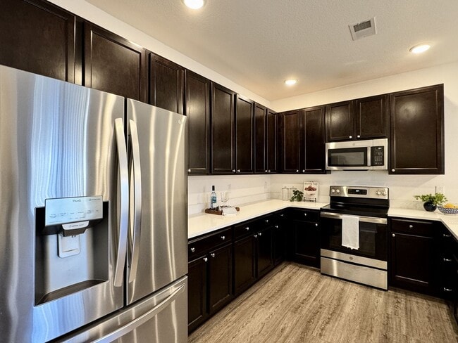 Building Photo - Available NOW! 1st Time Rental! Water, Sewer Trash, Landscaping, Community Pool Included!