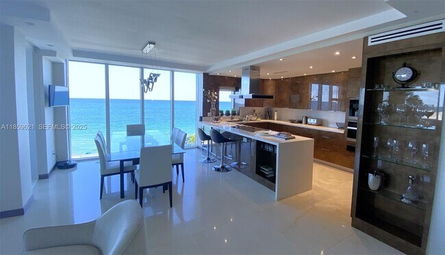 Building Photo - 10275 Collins Ave