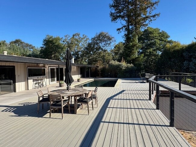 Building Photo - Stunning Deck and Pool for this Updated Mi...