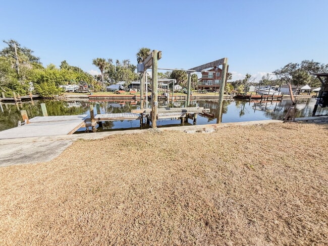 Building Photo - WATERFRONT POOL HOME ON A CANAL THAT LEADS STRAIGHT INTO TAMPA BAY - NEW DOCK AND SEAWALL COMING ...
