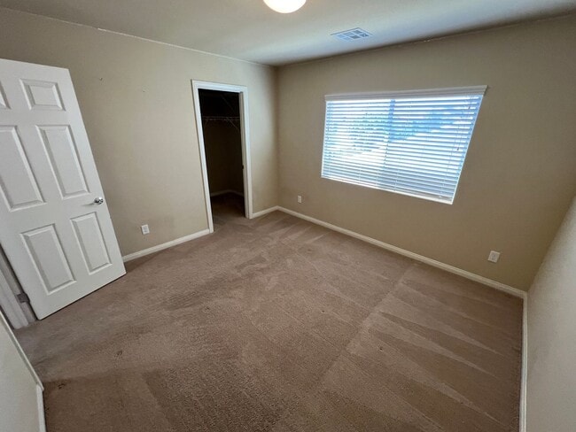 Building Photo - A Fantastic 4 Bedroom Home with the primary Downstairs, in Silverado Ranch