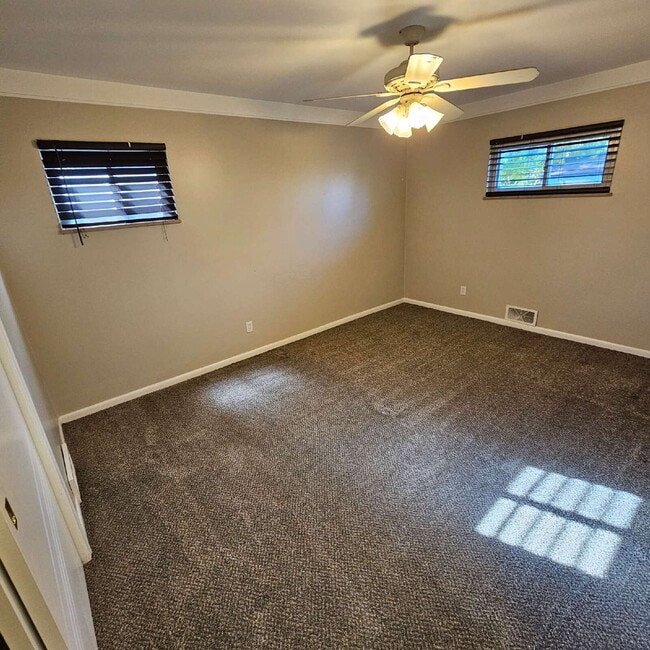 Building Photo - 3 Bedroom, 1.5 Bath Brick Ranch. Huge Great Room and Living Room. Big Kitchen, Backyard with Deck...