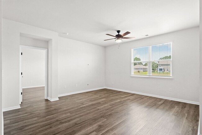 Building Photo - Modern 4BR Home with Screened Porch & Pond Views | Sun Colony, Longs SC