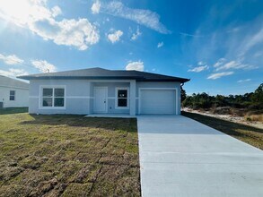 Building Photo - Brand-New Modern 2BR/2BA Home with Garage on Oversized Lot – Prime SW Lehigh Acres Location