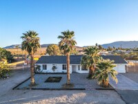 Building Photo - A Fully Furnished 3 Bedroom With Desert Mo...