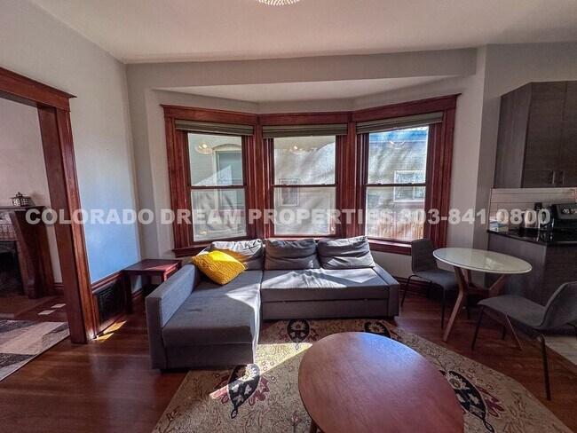 Building Photo - A home where old-world charm meets modern sophistication!