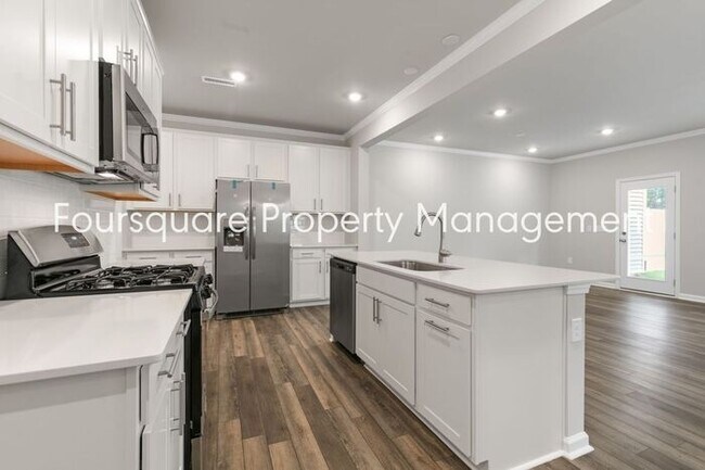 Building Photo - Coming Soon; July 27, 2026 : End unit ToSpacious End-Unit Townhome with 2nd Floor Loft, Screened-...