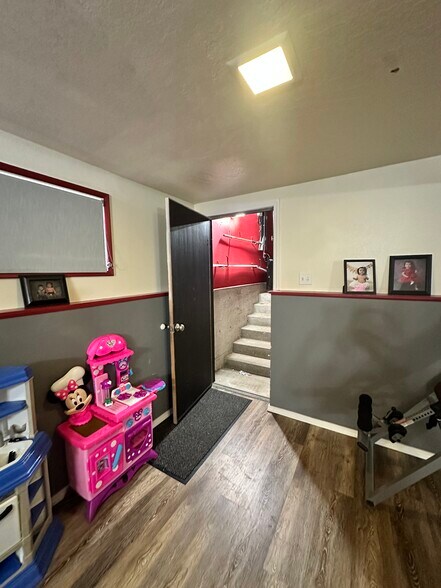Living room downstairs lead to the garage - 219 Thayer Dr