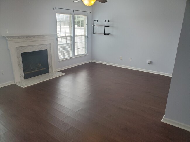 Living room with ceiling fan and gas fireplace. - 42 Gr-Pd-51