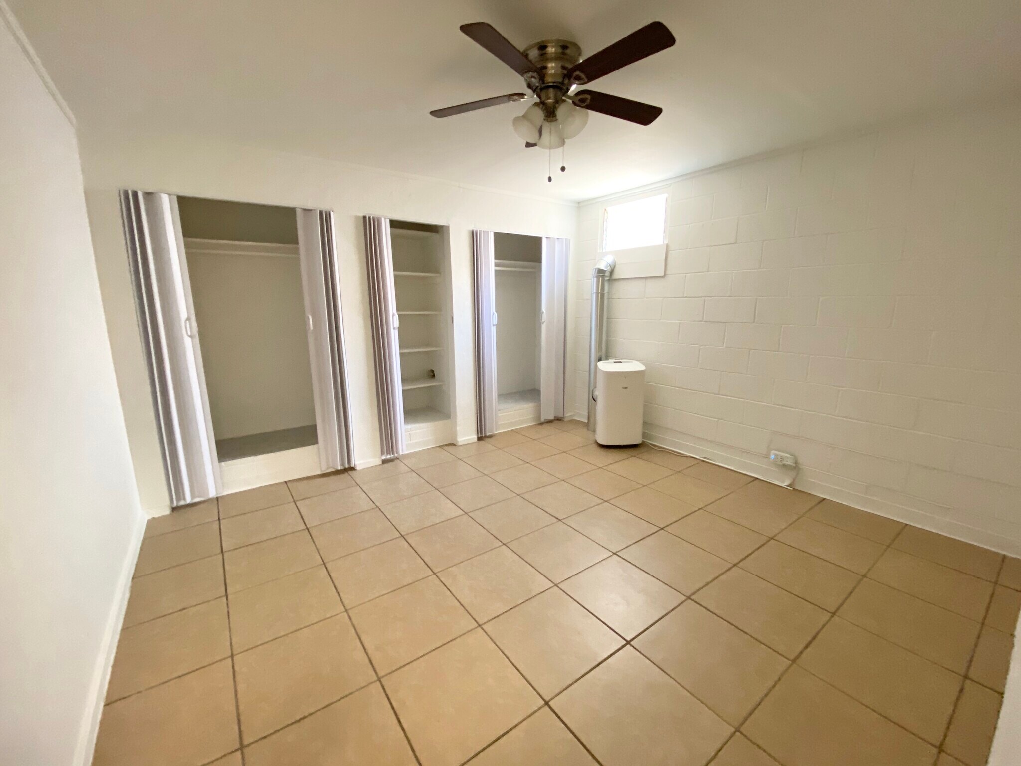 Master bedroom- Has new Split AC, new ceiling fan, new window - 1739 Kamohoalii St