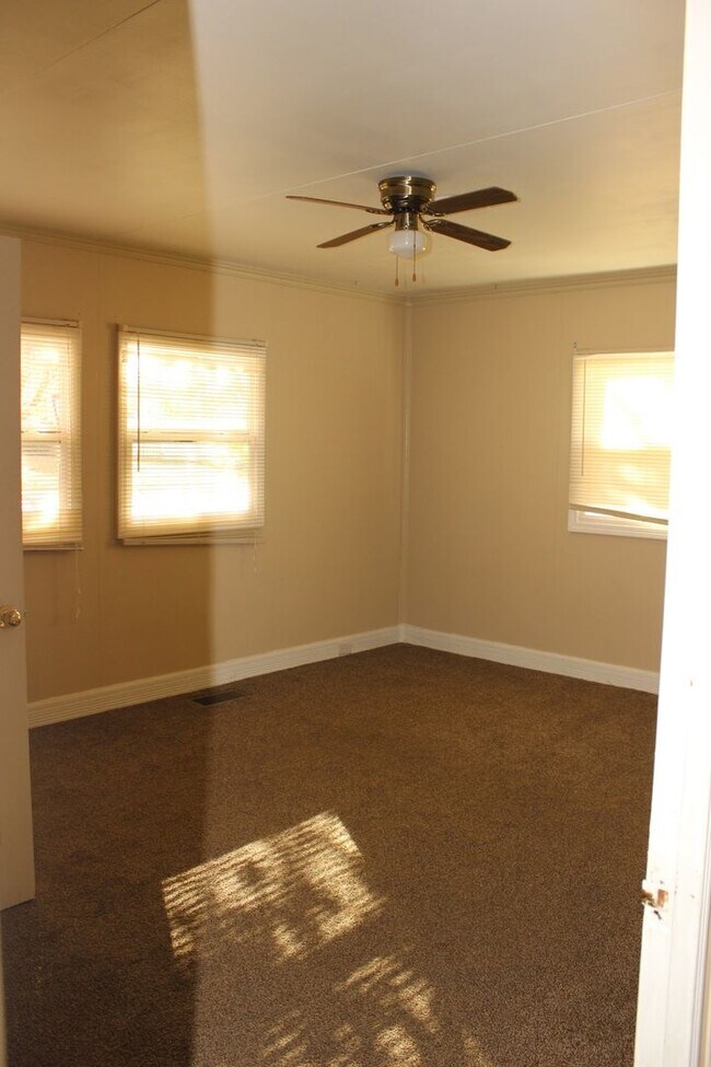 Building Photo - PRELEASING for AUGUST! Walk to Ball State! Spacious 4BR with Fenced Yard & Garage