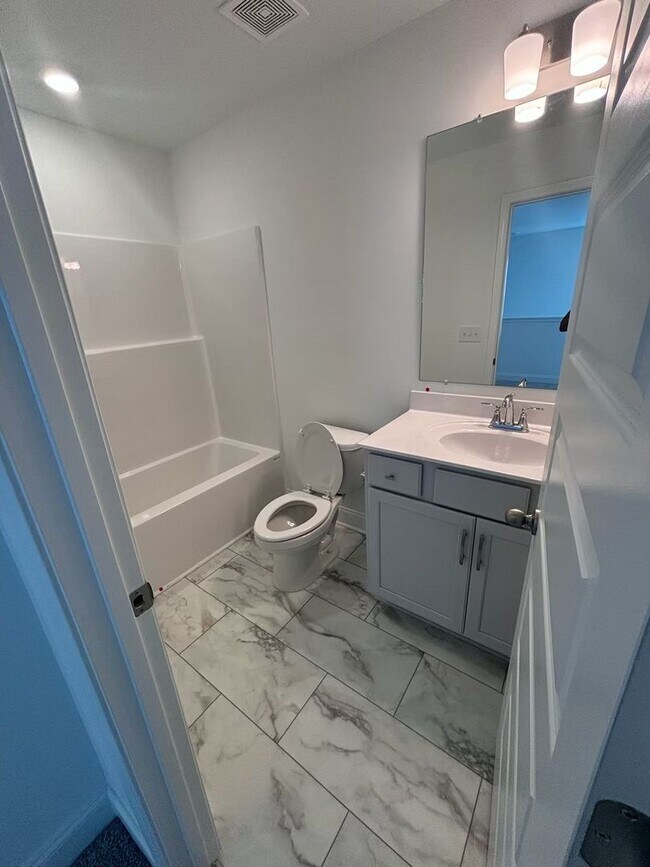 Building Photo - **BE THE LUCKY ONE TO LIVE IN THIS 2024-BUILT END-UNIT TOWNHOME IN A RESORT-STYLE COMMUNITY**