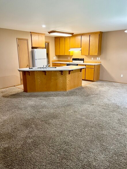 Living room into kitchen - 9928 148th Street Ct E