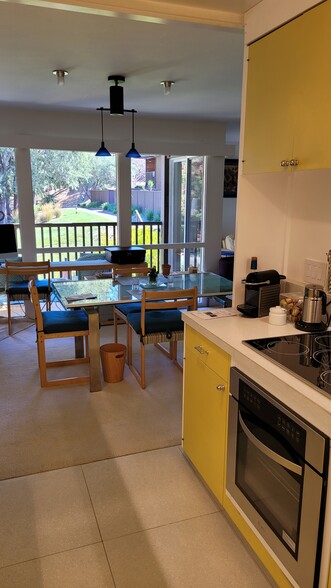 Kitchen open to dining area. - 72 Surrey Ln