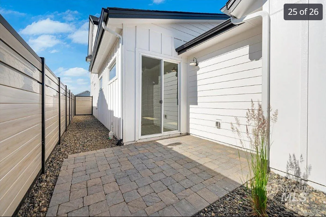 Back patio and side yard fenced - 5662 W Elk Trail St