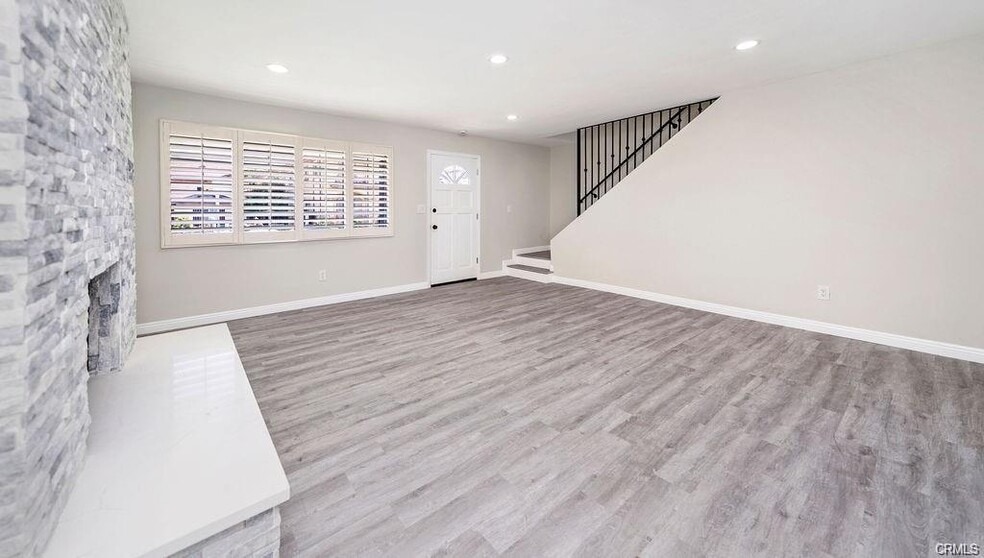 Large living room with luxury vinyl plank flooring, plantation shutters, recessed lights.... - 2323 Harriman Ln
