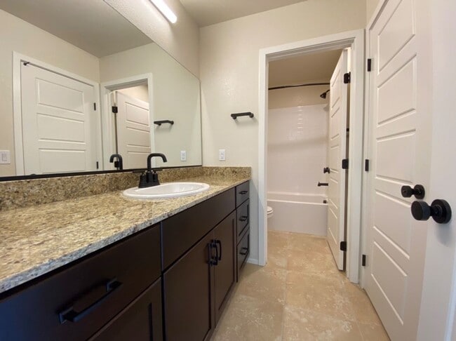 Building Photo - 4 BED 3 BATH Townhome, 1 LOFT, 2 GARAGES, GATED!