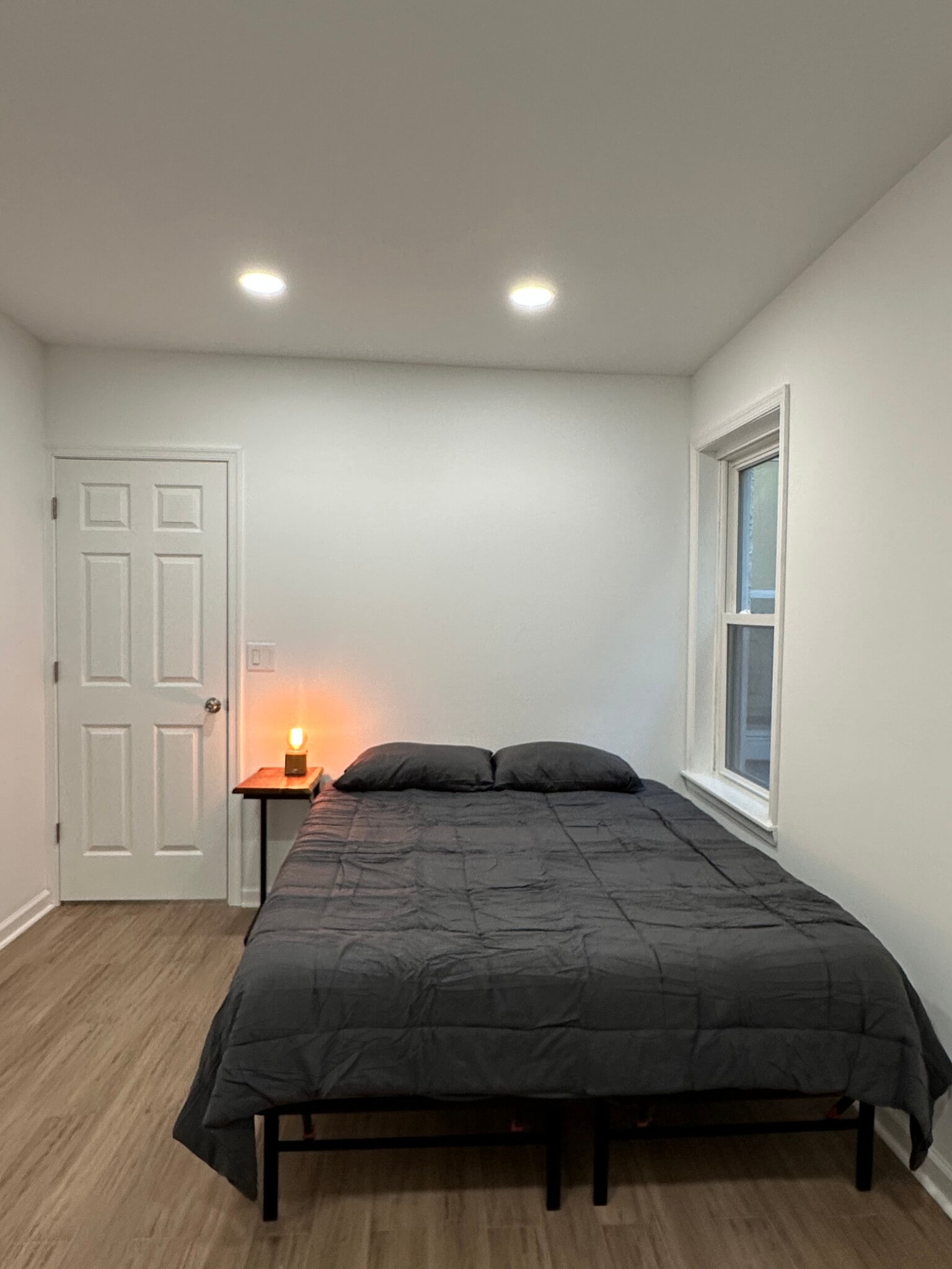 2nd bedroom with queen size bed, a desk, and a chair. Small closet next to desk. - 313 N 37th St