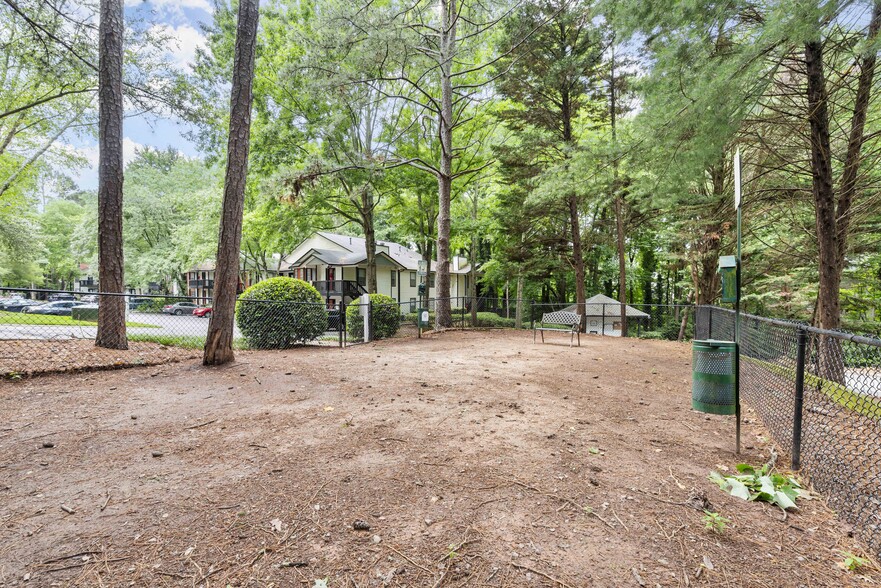 Let your pup run free in our spacious dog park. - The Addison at Sandy Springs