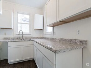 Building Photo - SW 4 bedroom 2 bath with 2 stall garage ne...