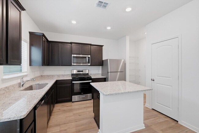 Building Photo - Clean & Modern Townhome with No Carpet and Lawn Service Included