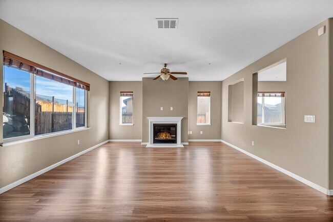 Building Photo - Sun-Filled, Spacious Living with a Three-Car Garage