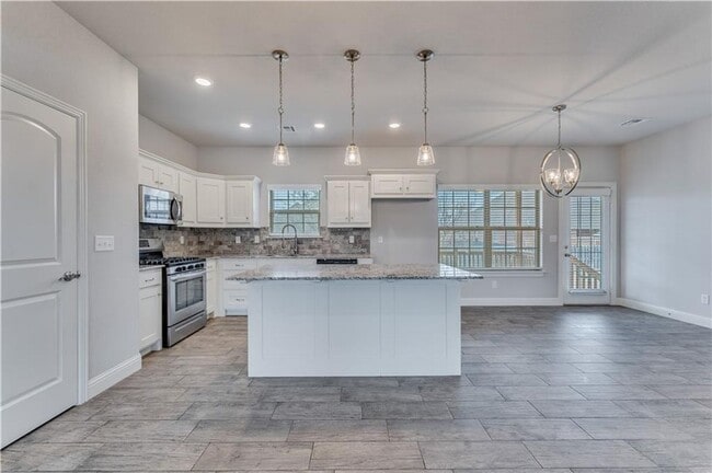 Building Photo - Minutes from I-49! 4BR/2.5BA Home