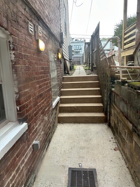 Basement apartment pathway to backyard - 71 W St NW