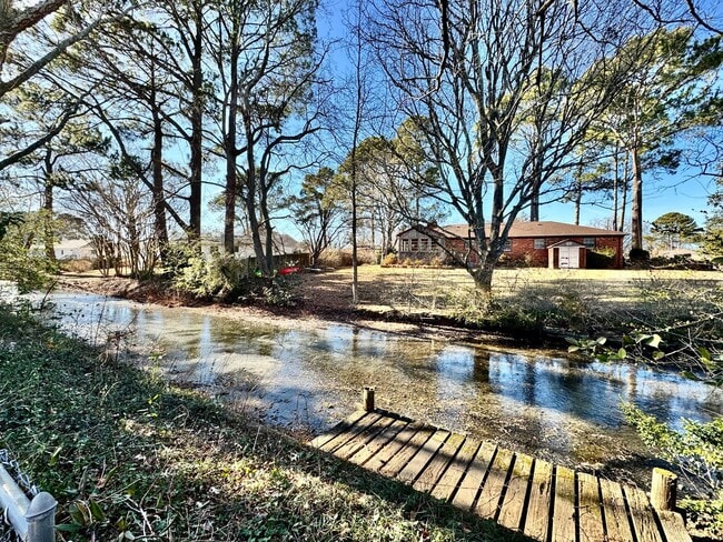 Building Photo - Available NOW! Lakefront 4 Bedroom/2 Bath Home, Pet-Friendly, Fenced Yard, Great School Zones!